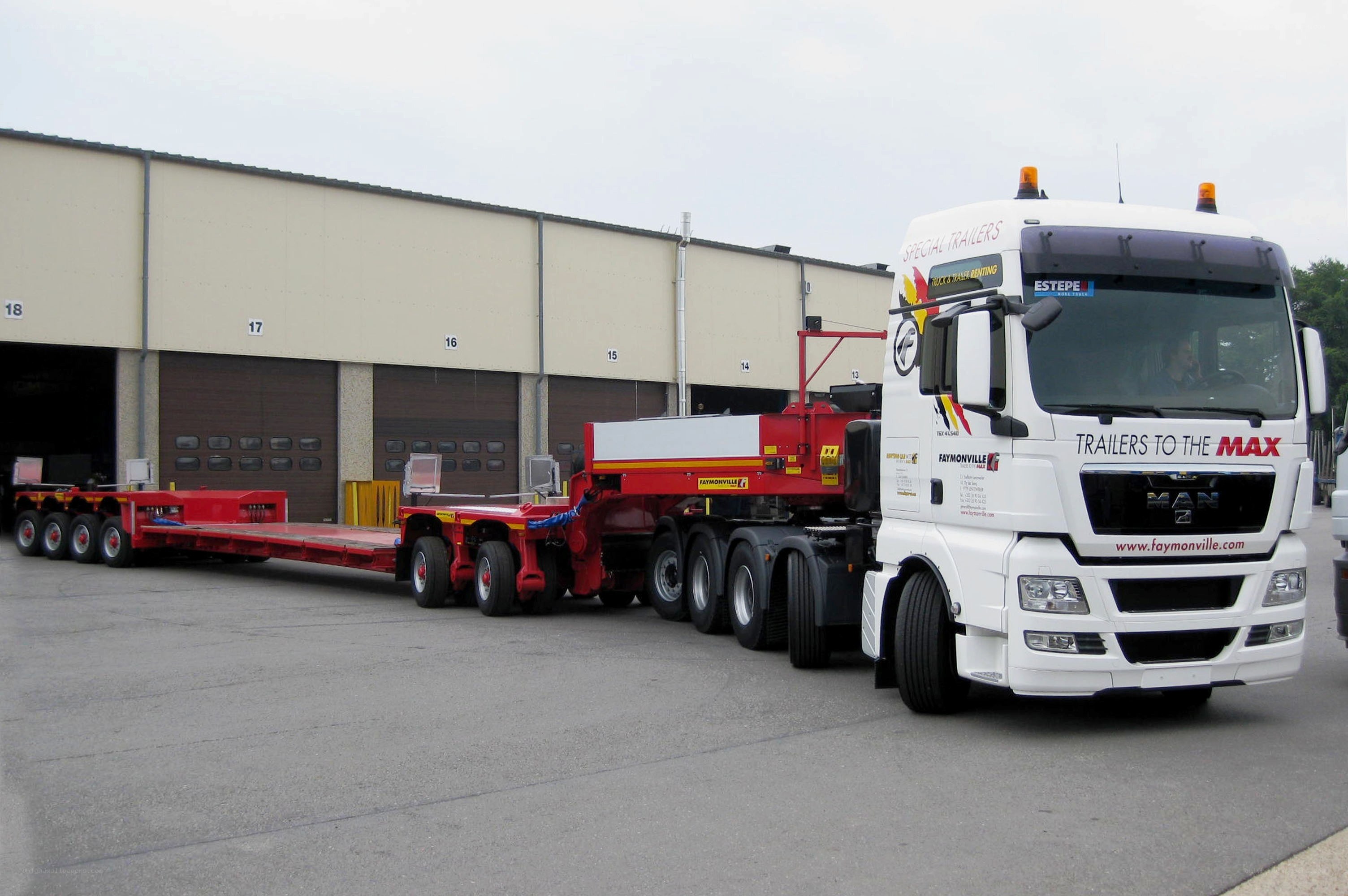 White truck with red trailers