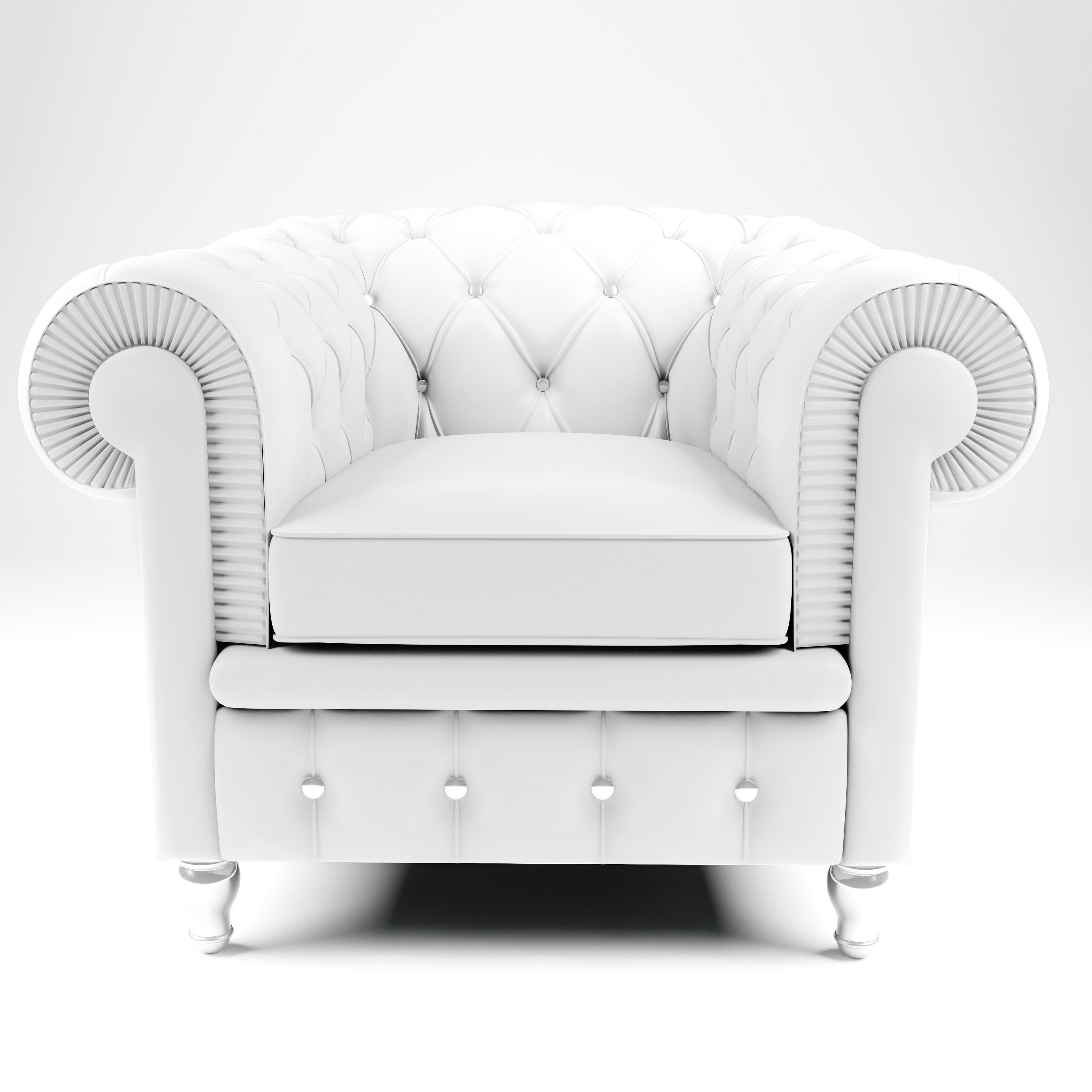 white tufted armchair