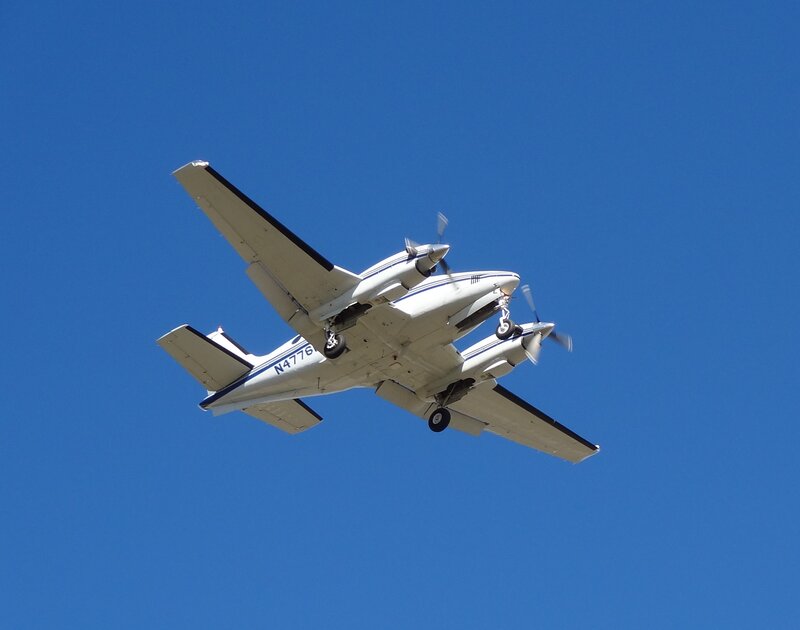 White Twin-engine Plane — Blue