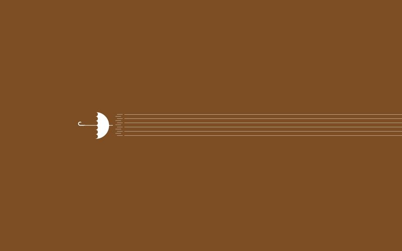 white umbrella on brown background