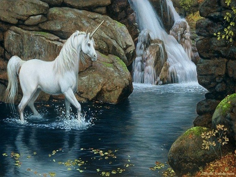 White unicorn by a waterfall