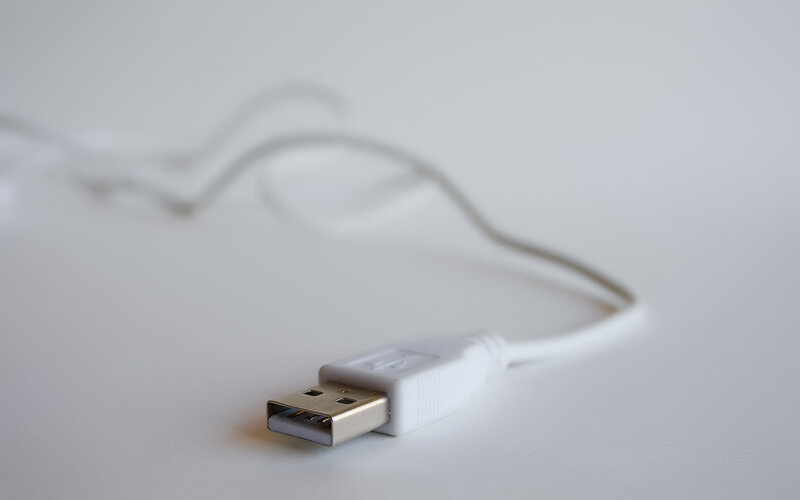 white usb cable on white surface