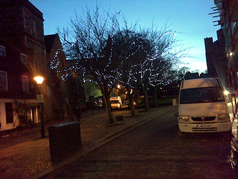 White Van on Cobblestone Street
