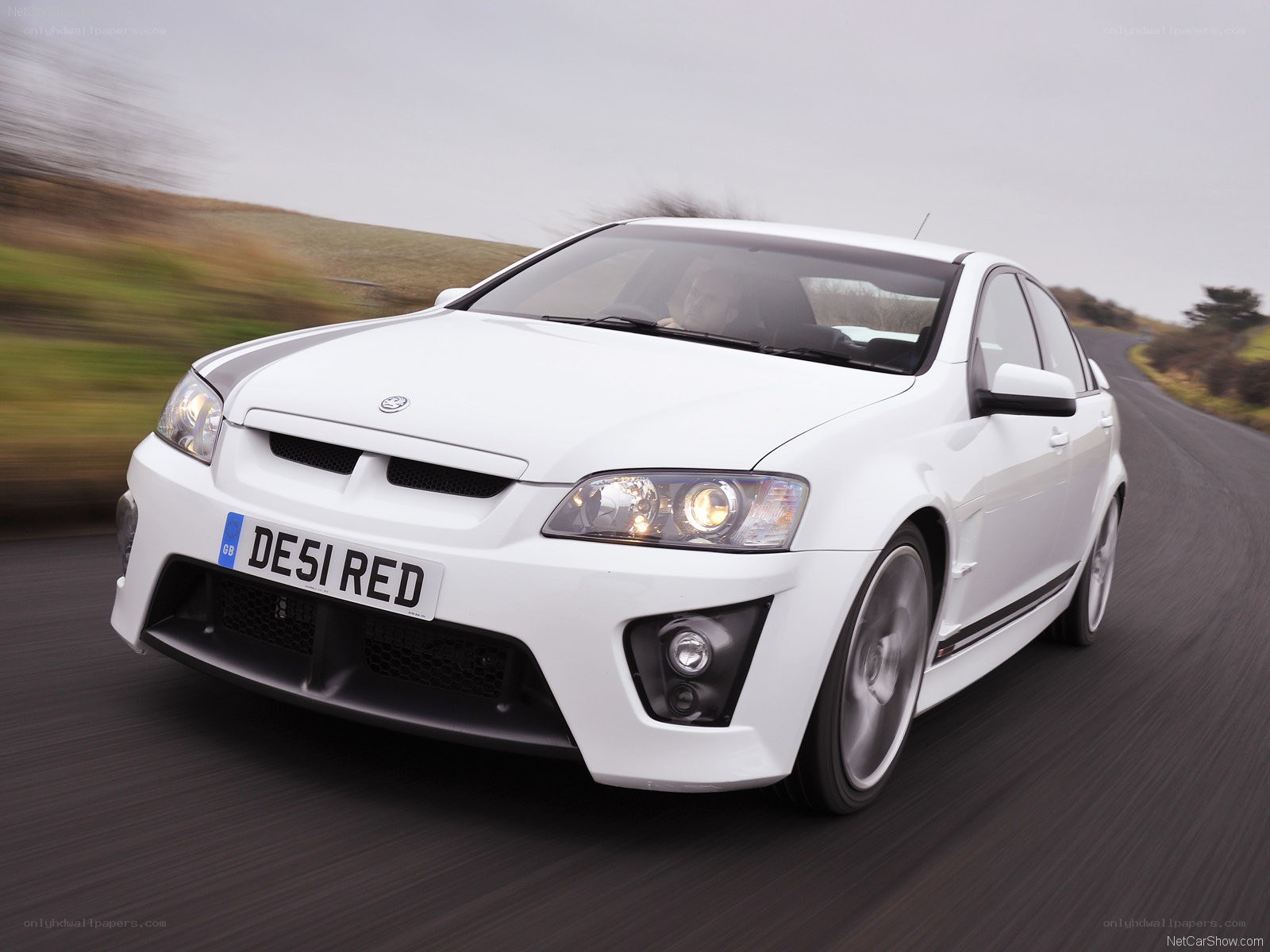 white Vauxhall Monaro in motion