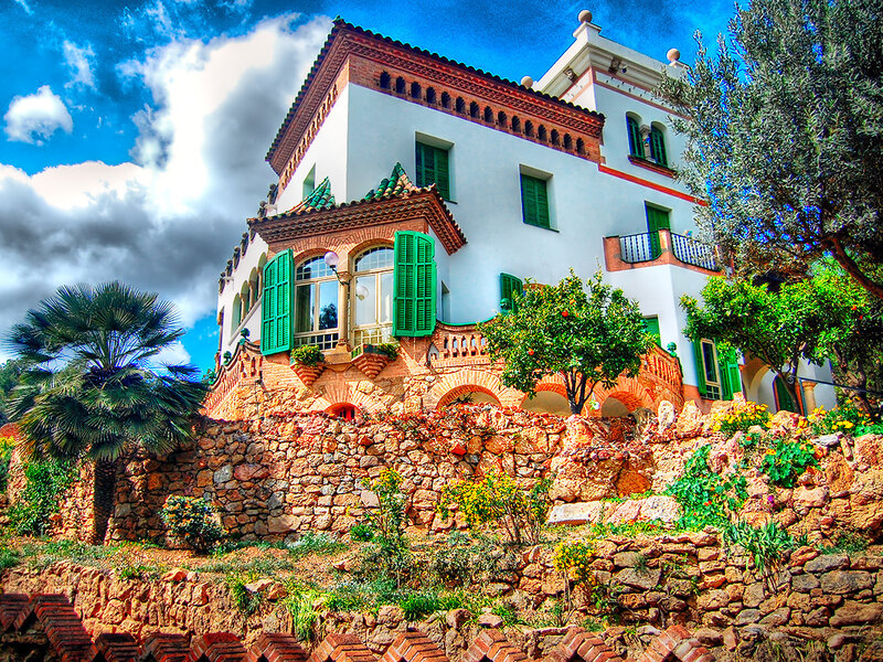 White villa with green shutters