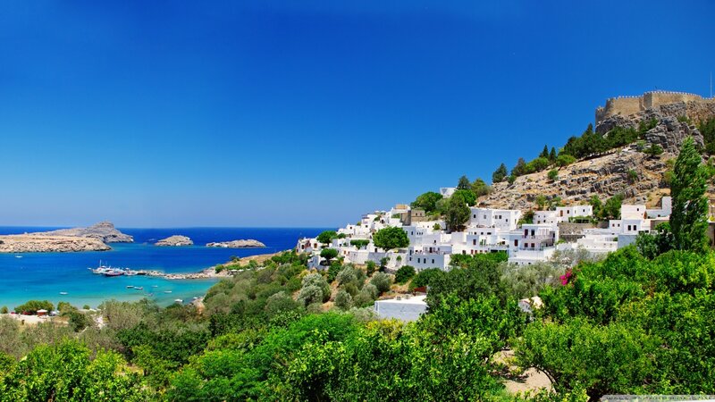 White Village on Hillside — Blue, Serene, Afternoon, Photograph, Sea