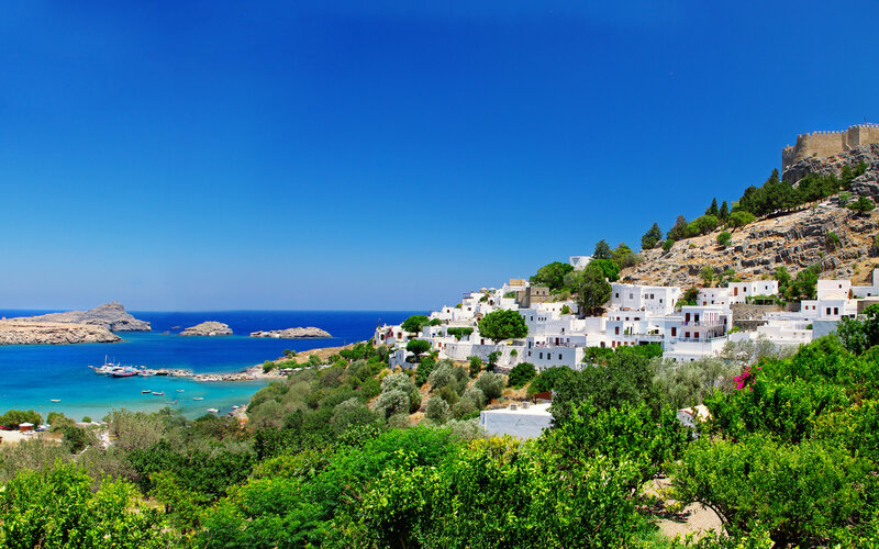 White Village on Hillside — Blue, Serene, Afternoon