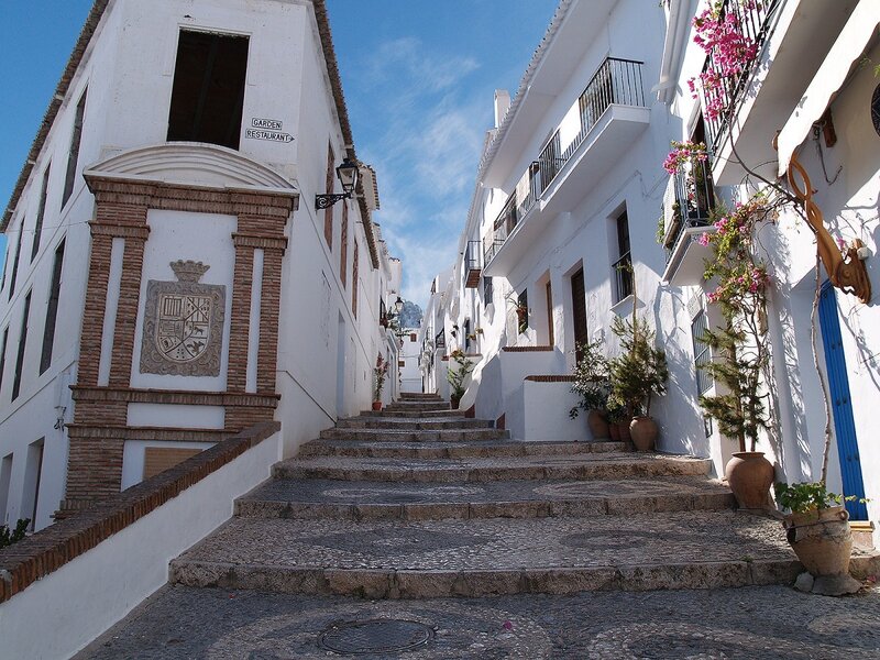 White village street with steps