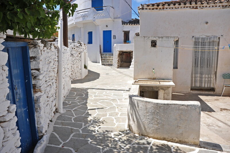 white village with blue doors