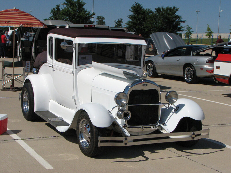 White vintage car at a show