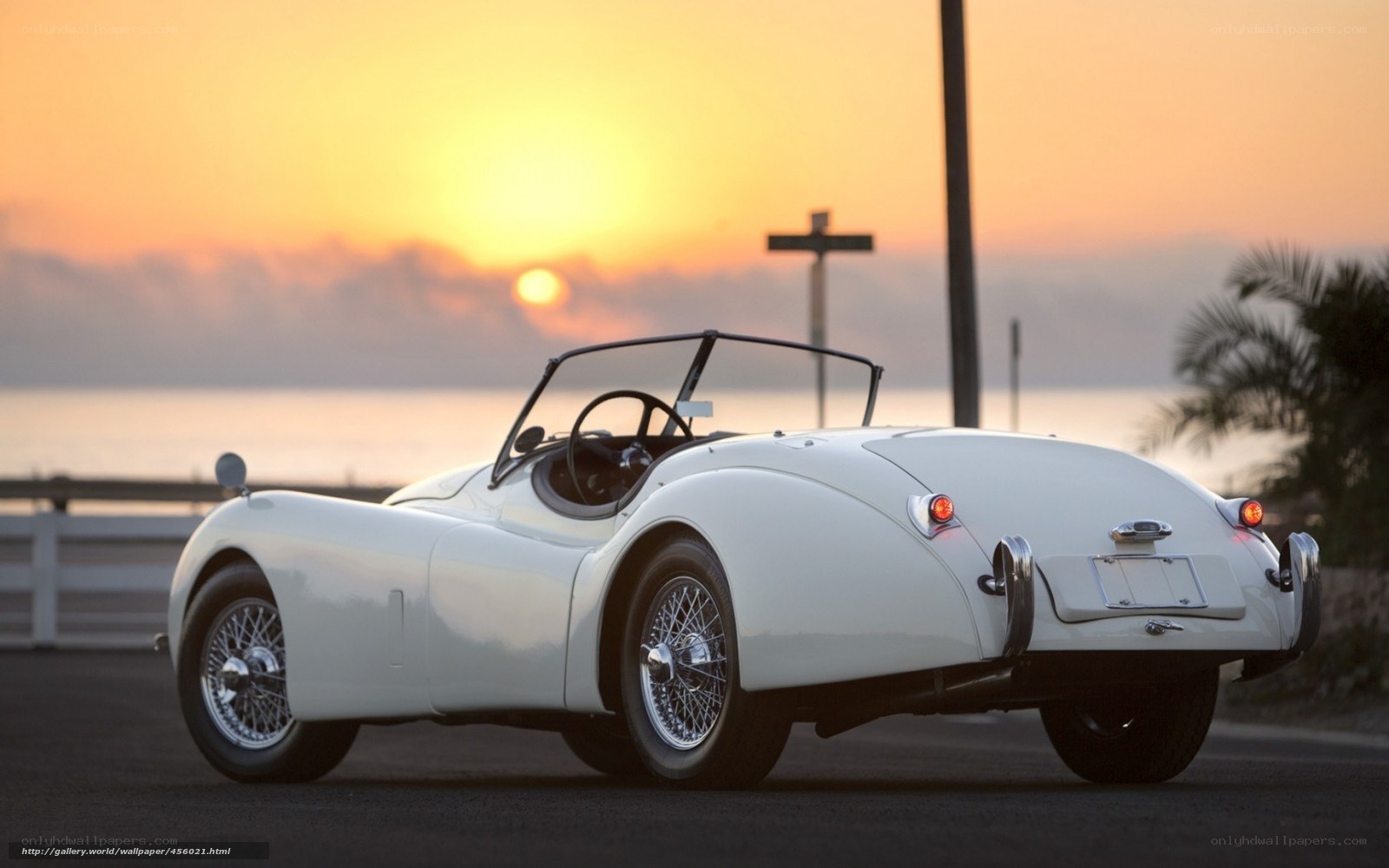 White vintage car at sunset