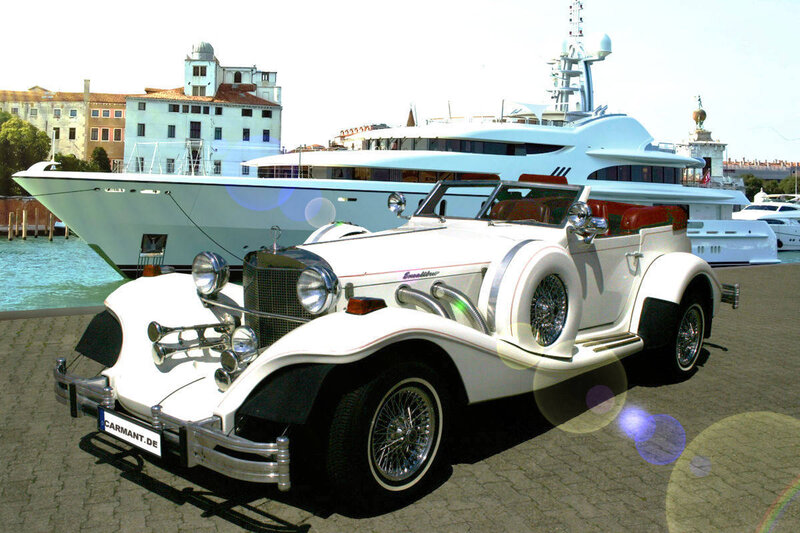 White vintage car by yacht