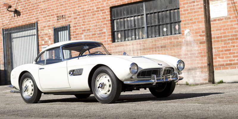 White Vintage Car — Calm, Afternoon, Photograph, Brick Building, Window