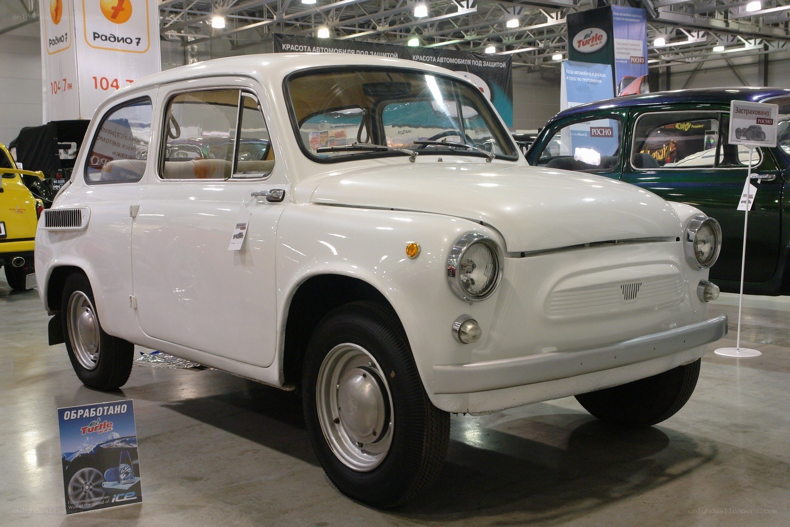 White vintage car on display