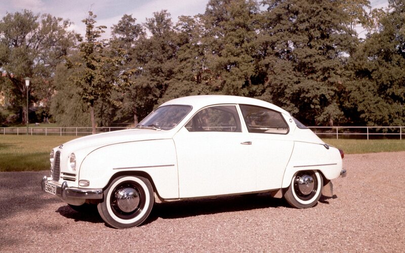 White vintage car on gravel