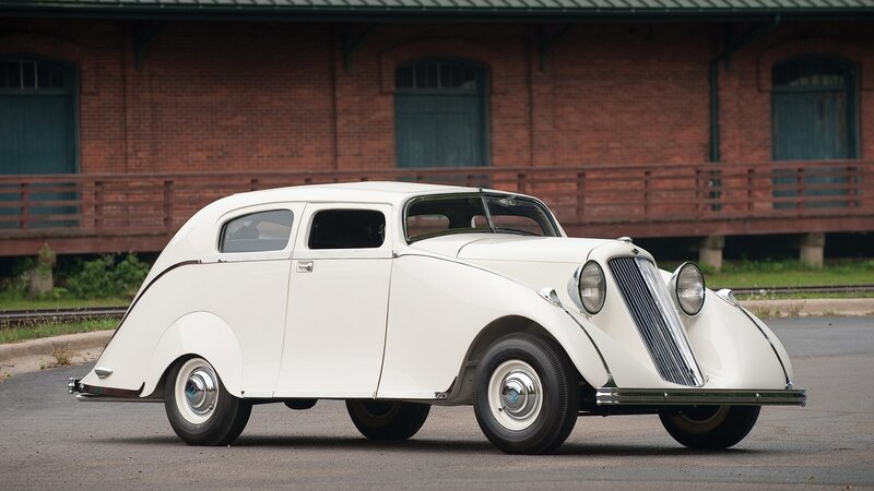 white vintage car on pavement