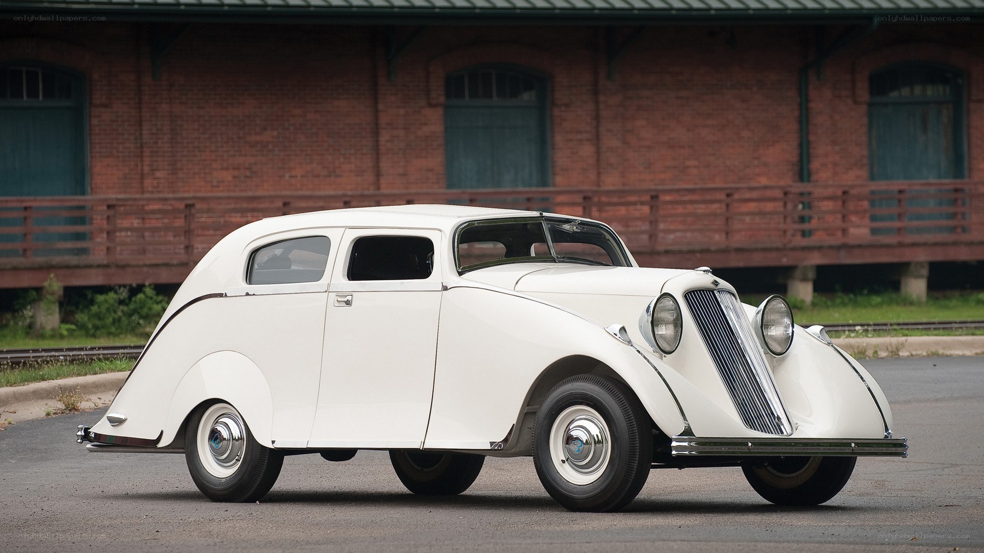 white vintage car on pavement