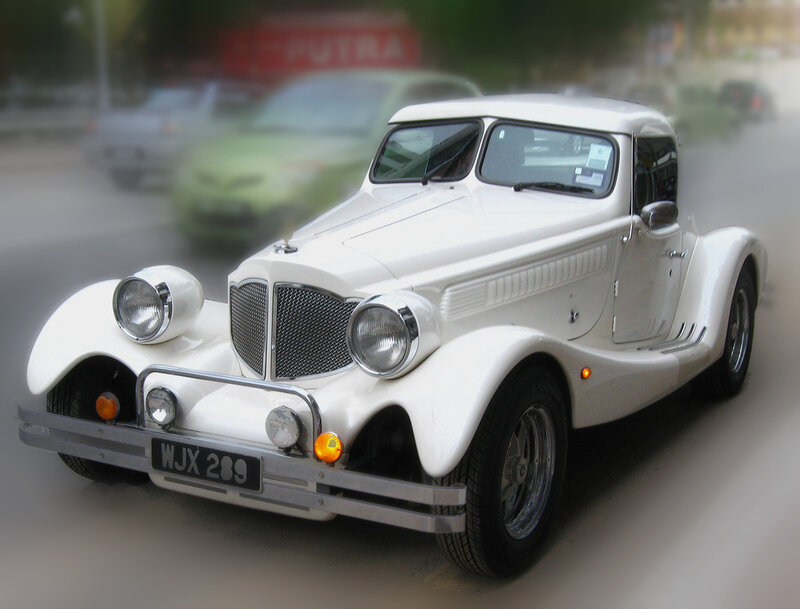 white vintage car on street