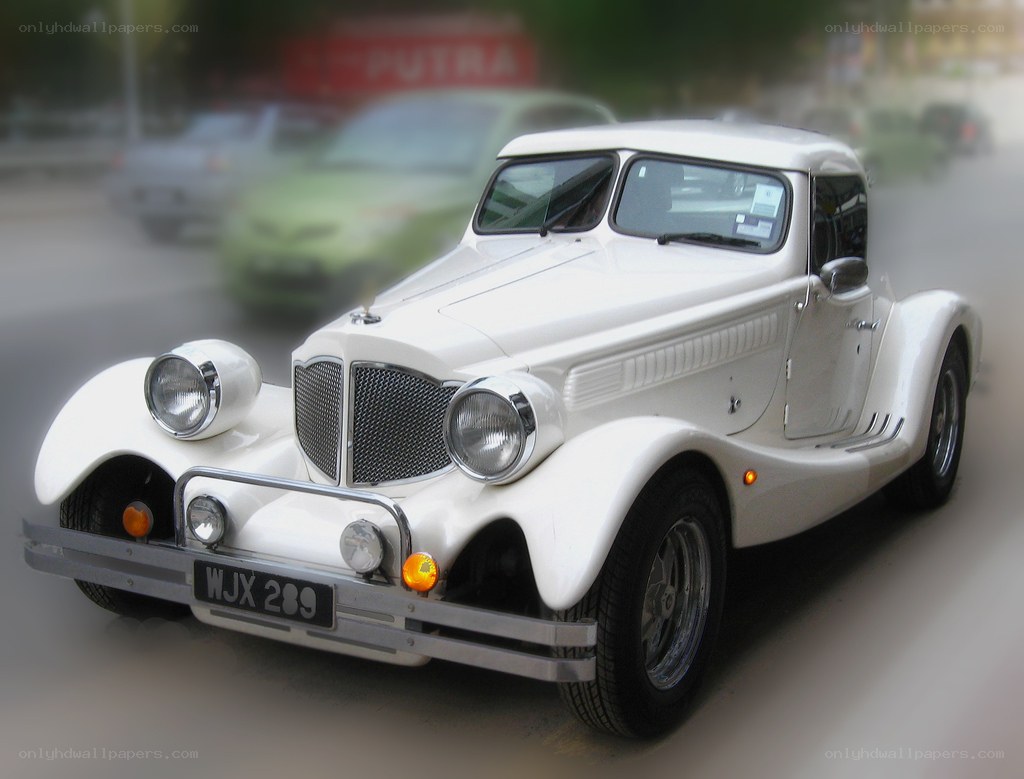 white vintage car on street