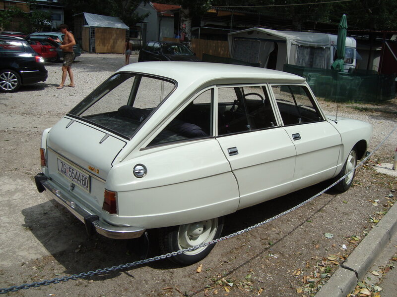 White vintage car parked outdoors