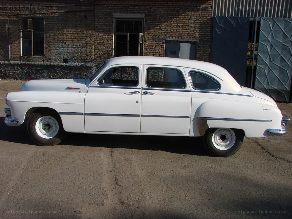 white vintage car parked outside