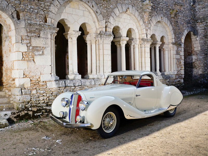 White Vintage Car — Serene, Afternoon, Photograph, Stone Building