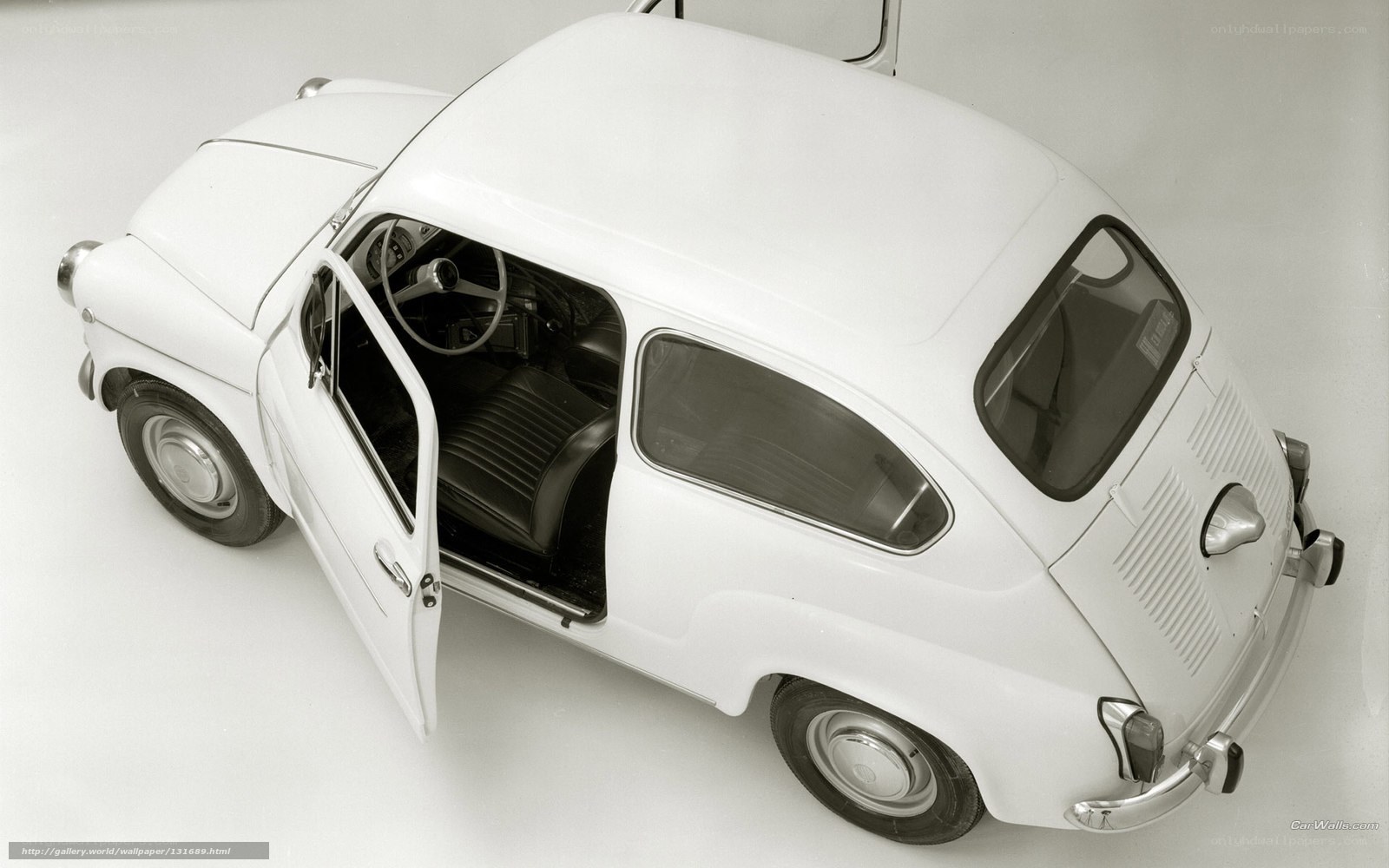 White vintage car with open door