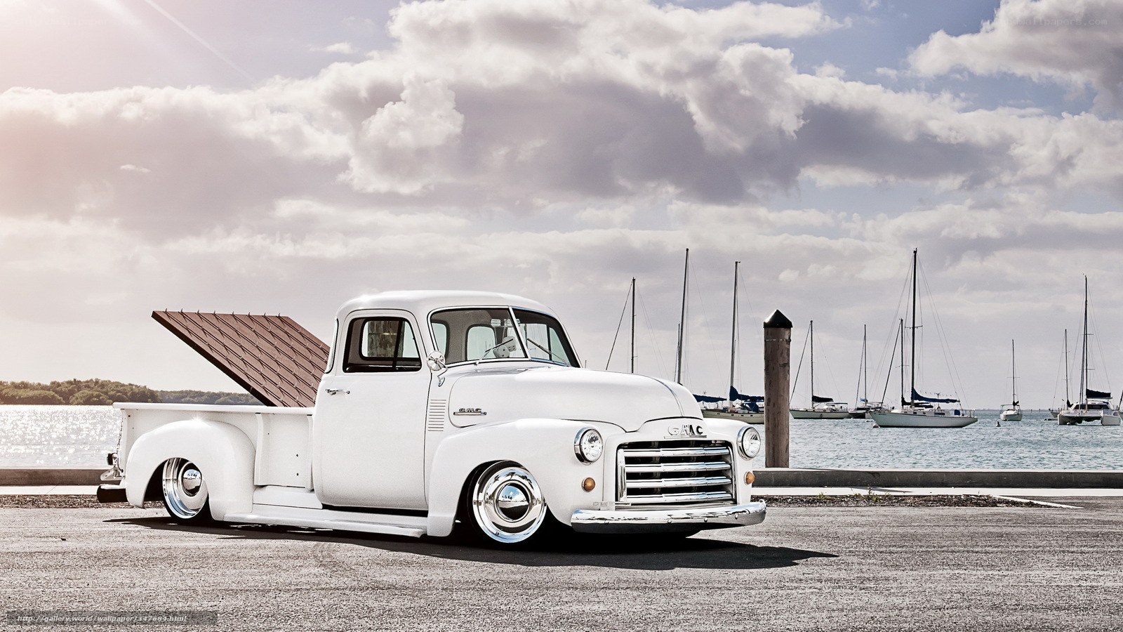White vintage pickup truck by the water