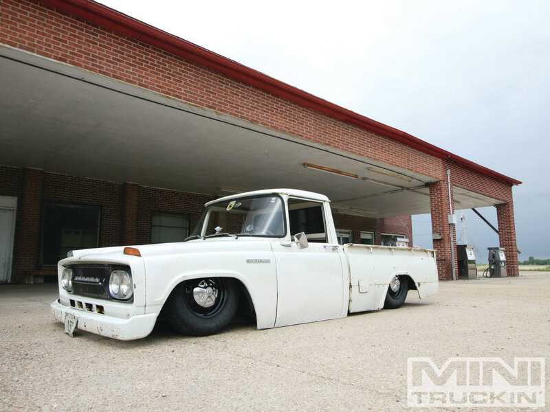 White Vintage Pickup Truck — Calm, Afternoon, Photograph, Brick Building