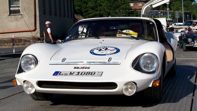 White vintage race car on display