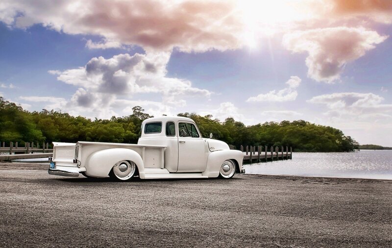 white vintage truck by the water