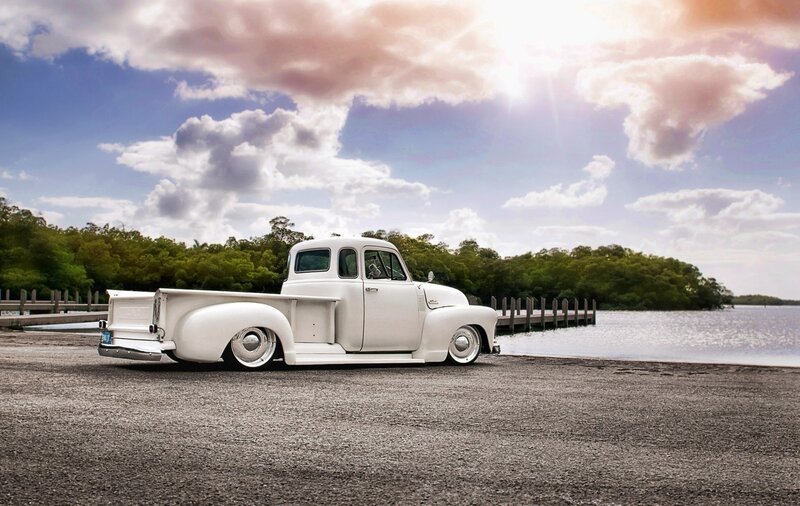 white vintage truck by the water