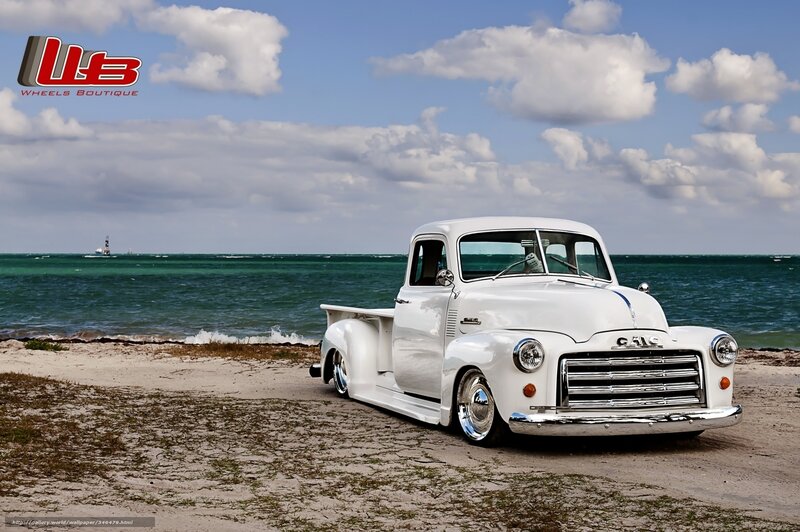 White vintage truck on beach