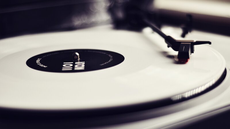 white vinyl record on turntable