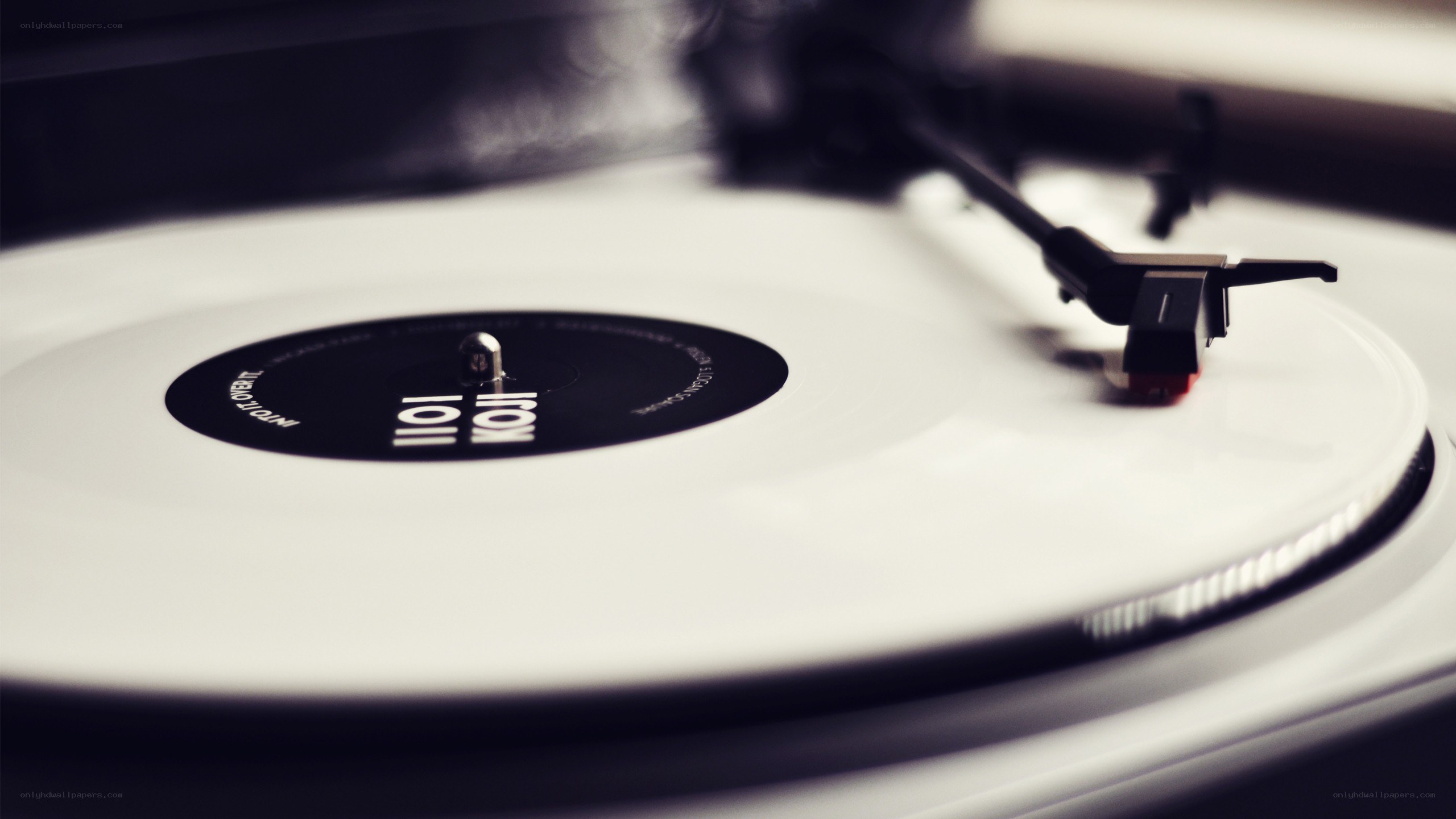 white vinyl record on turntable