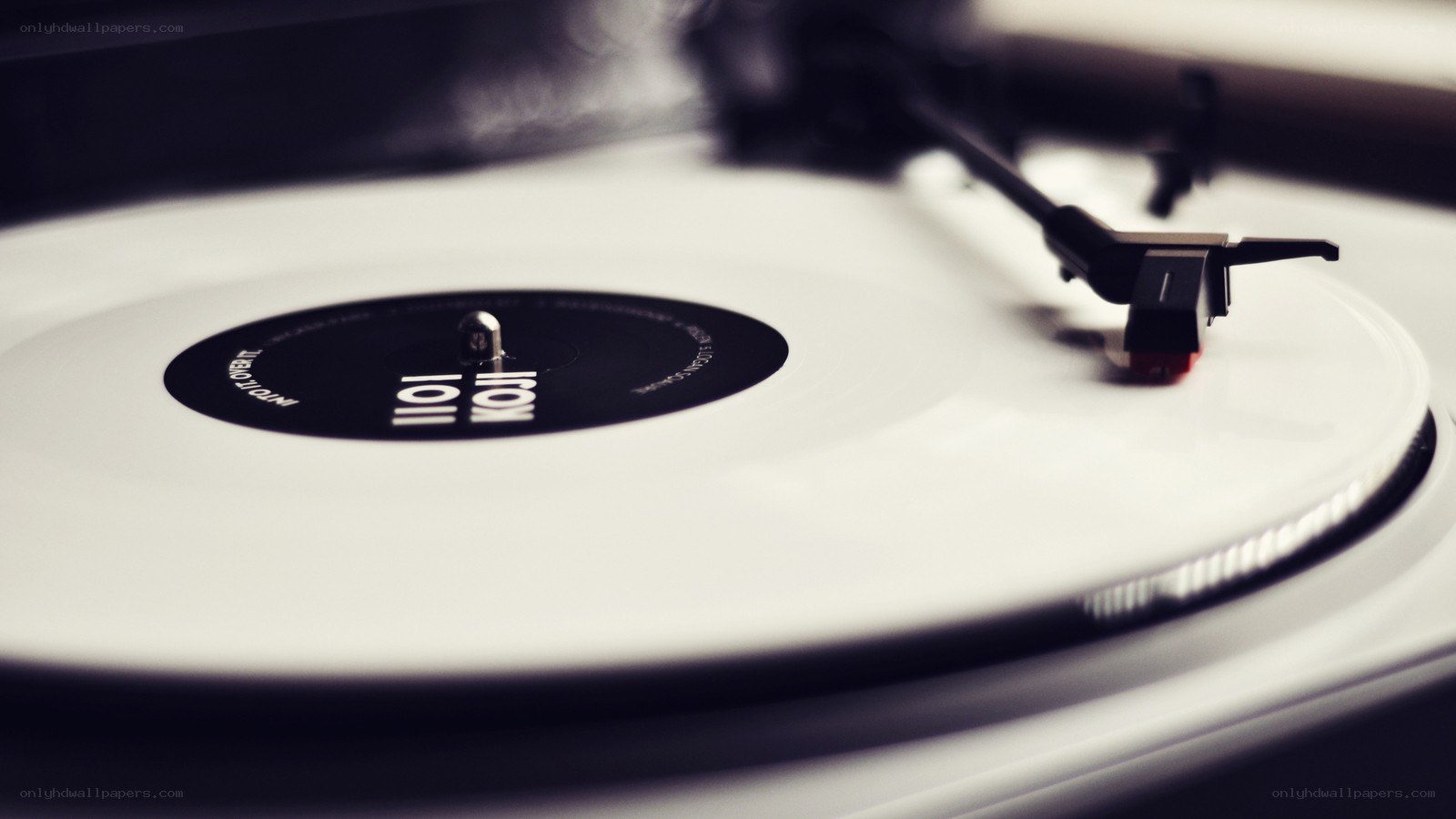 white vinyl record on turntable
