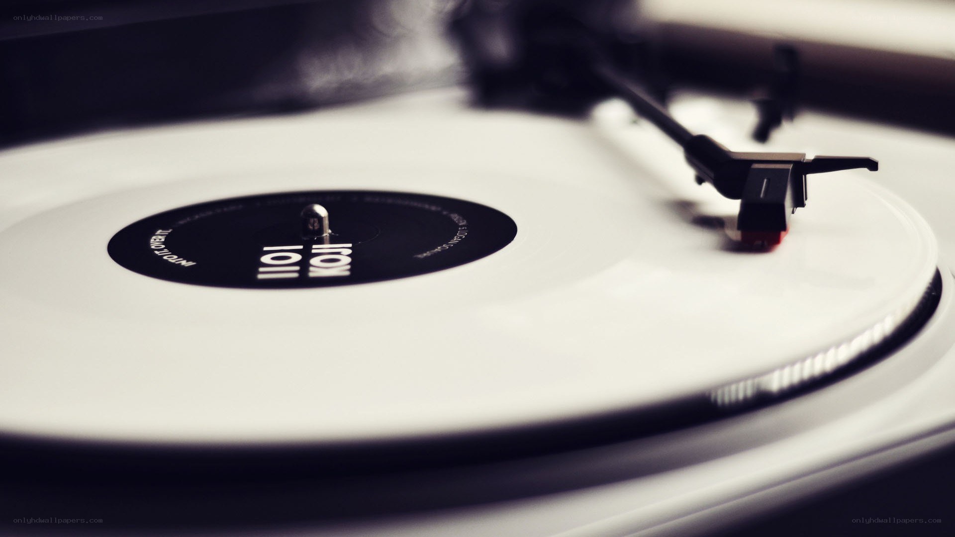 white vinyl record on turntable