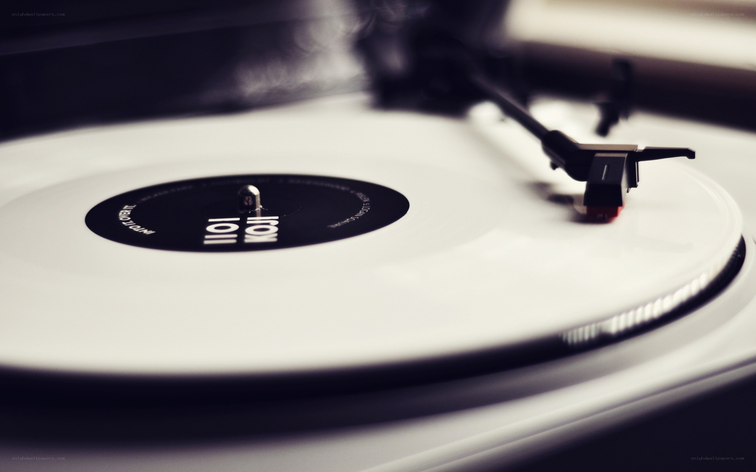 white vinyl record on turntable
