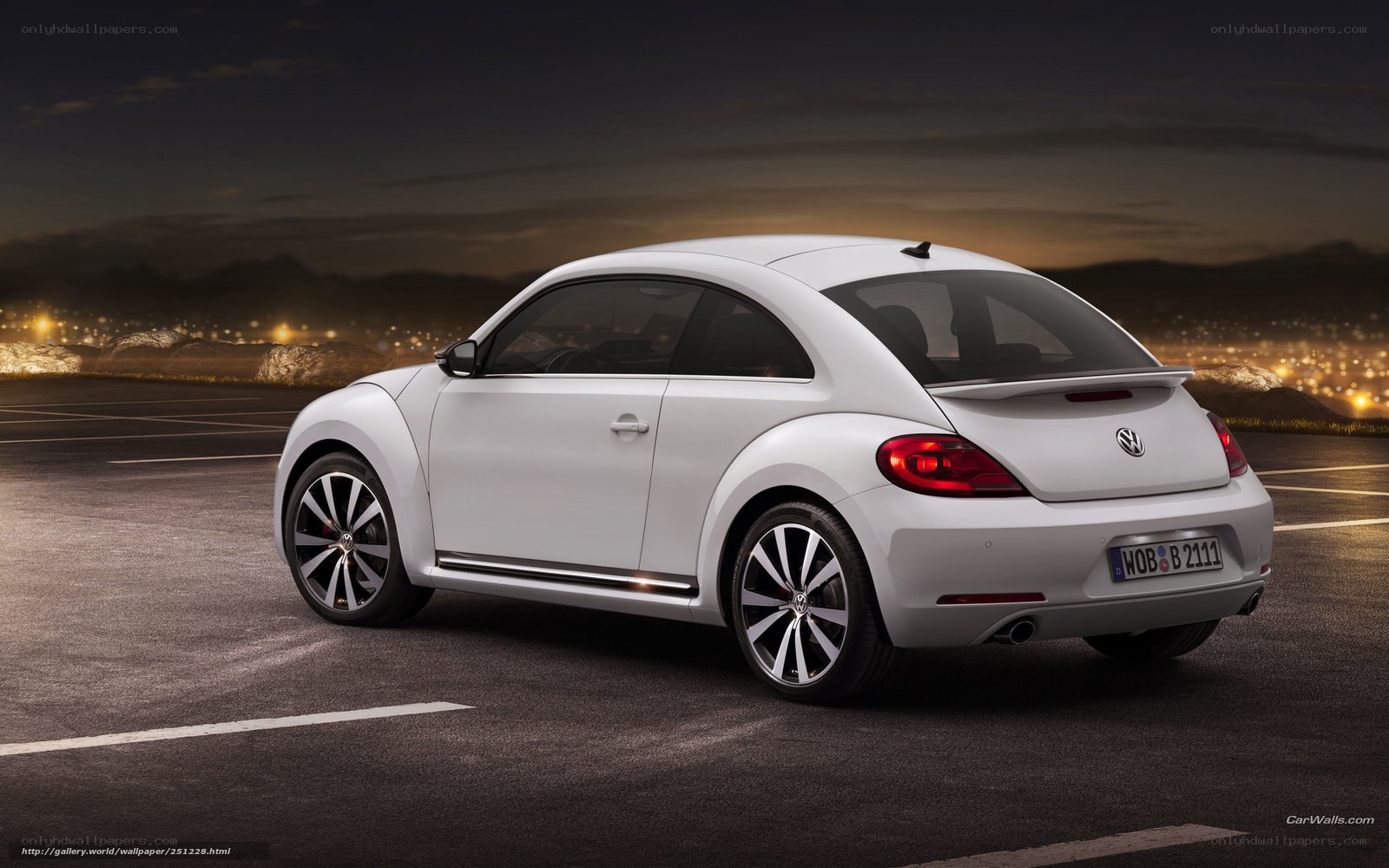 White Volkswagen Beetle at night