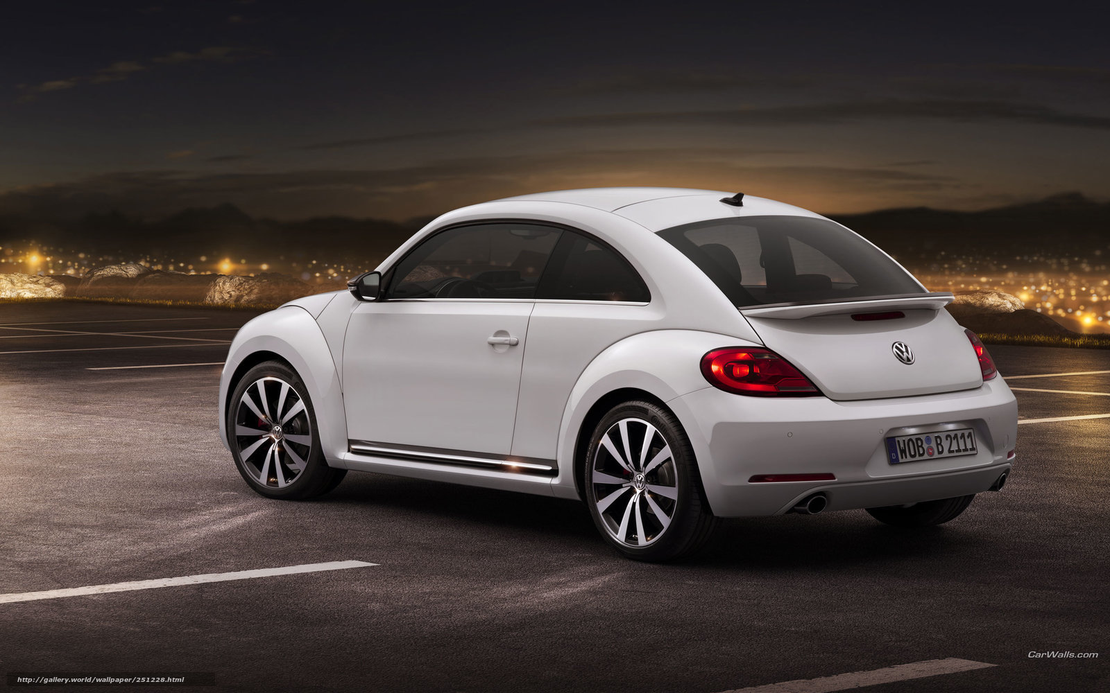 White Volkswagen Beetle at night