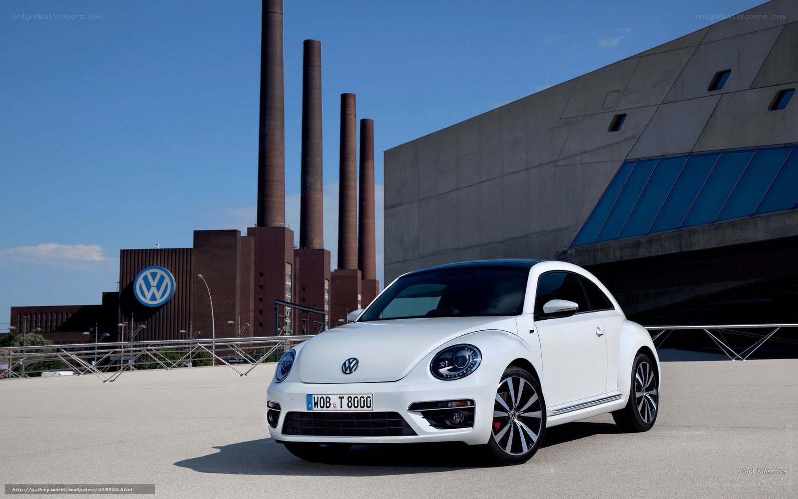 White Volkswagen Beetle in industrial setting