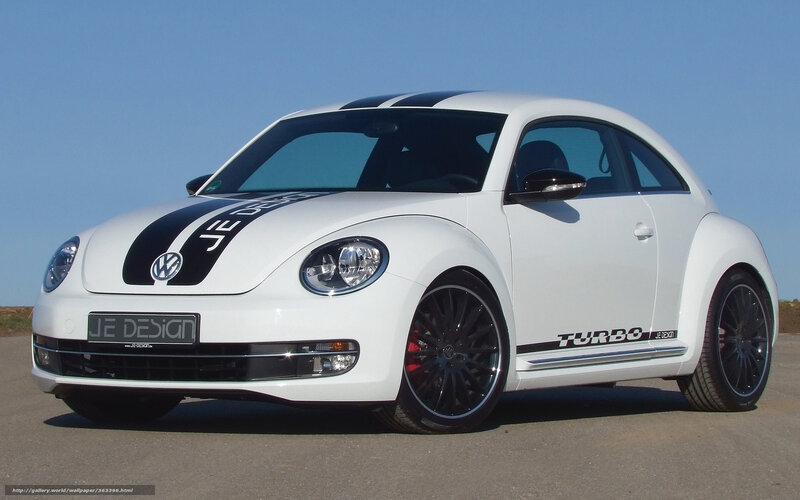 white volkswagen beetle with decals