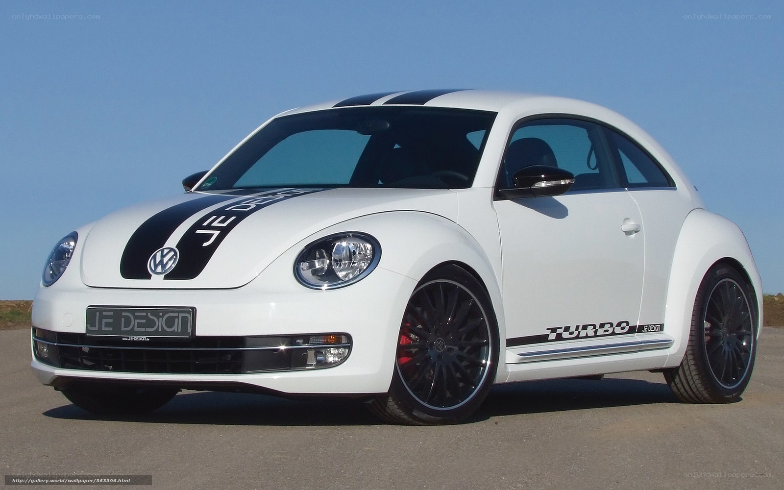 white volkswagen beetle with decals