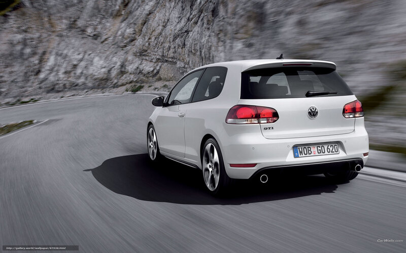 white volkswagen golf gti driving