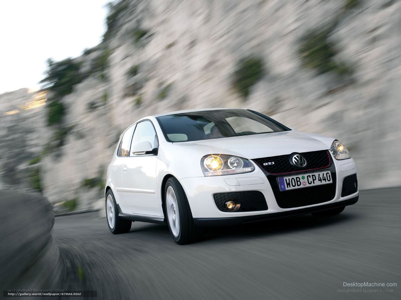 white volkswagen golf gti in motion