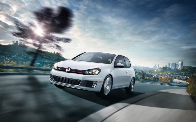 White Volkswagen GTI on a winding road