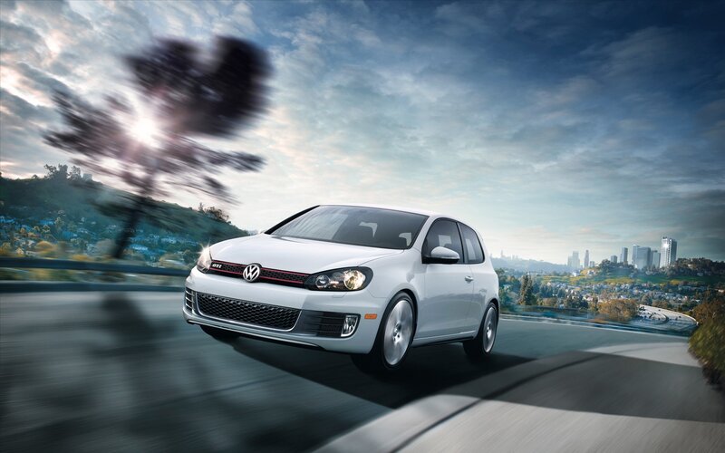 White Volkswagen GTI on a winding road