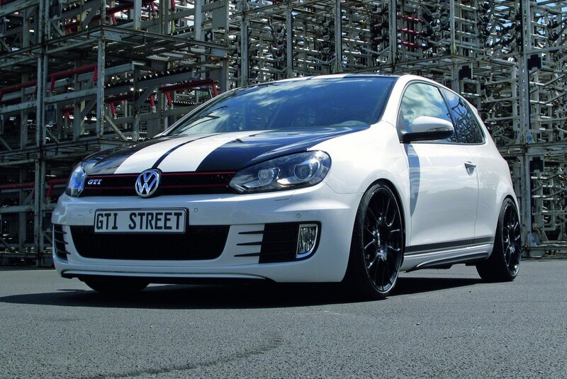 White Volkswagen GTI with racing stripes