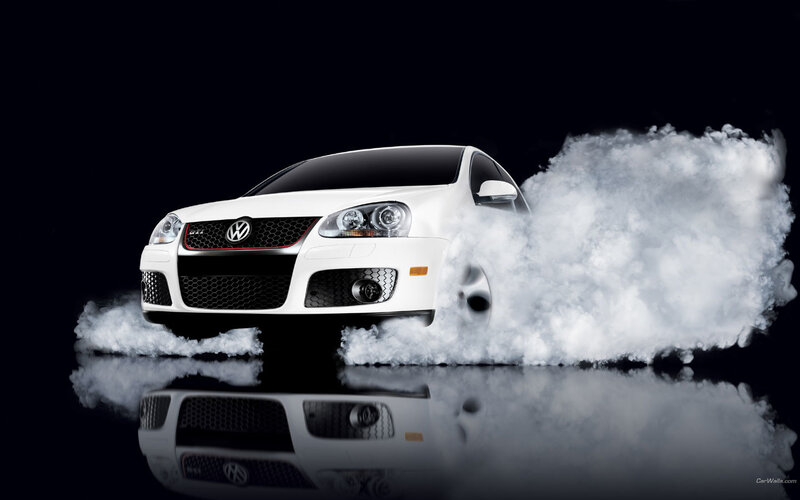 White Volkswagen GTI with smoke