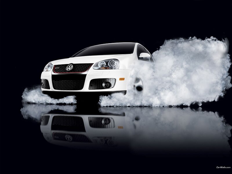 White Volkswagen GTI with smoke